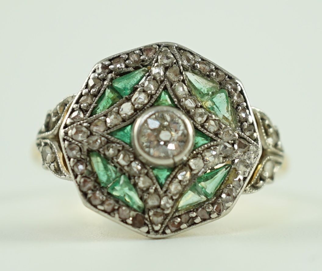 A Belle Epoque gold, emerald and diamond cluster set octagonal dress ring